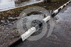 Accident of water supply, sewage. From under the crack in the asphalt poured a water fountain of dirty sewage. Breakthrough