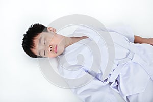 Accidents in sports. Asian child athletes taekwondo lying down u