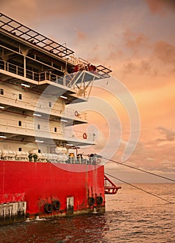 Accommodation barge during sunset at sea