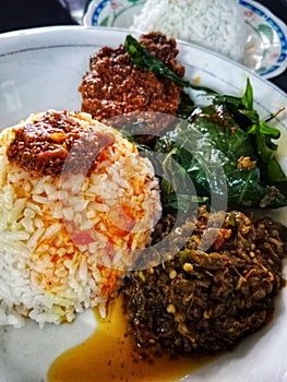 according to CNN this food is the most delicious food in the world and the name of this food is rendang photo