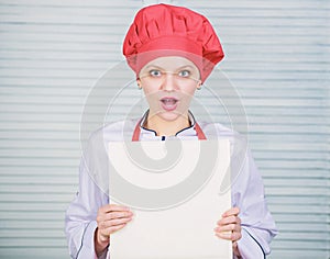 According to recipe. Woman chef cooking food. Culinary concept. Amateur cook read book recipes. Girl learn recipe. Book