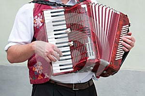 an accordion player in the street
