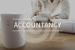 Accountancy text over accountant or financial adviser photo