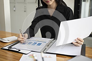 Accountant analyzing financial reports at office.