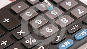 Accountant or banker using a calculator to calculate numbers. Accounting concept