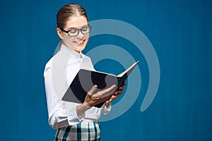 Accountant business woman wearing glasses portrait with book