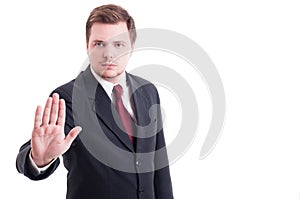 Accountant or businessman showing stop and stay gesture