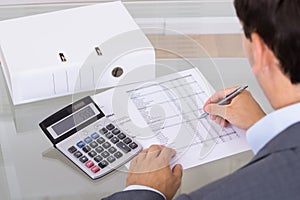 Accountant calculating finances photo