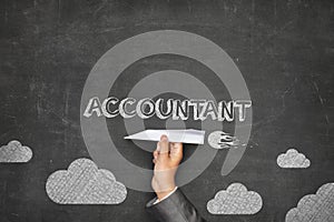 Accountant concept on blackboard with paper plane