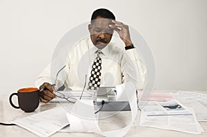 Accountant With Expense Receipt And Documents photo