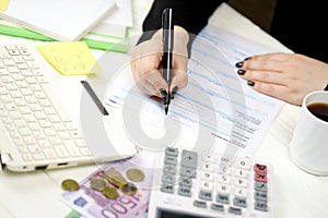 Accountant fill italian tax form F24 Unified payment model in end of tax period. Taxation and paperwork routine photo
