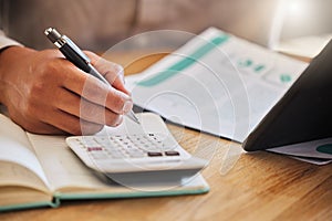 Accountant or financial advisor calculating the tax, expenses or budget for a business in an office. Closeup of male