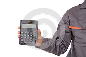 Accountant holding calculator in hand in front of white background