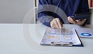 Accountant holding documents preparing performance analysis report Executives create documents