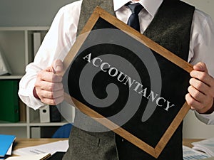 Accountant with inscription accountancy. photo