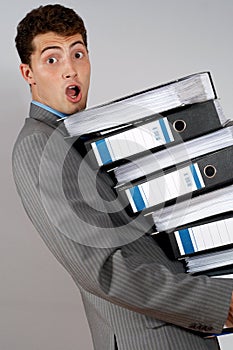 Accountant with pile of docume photo