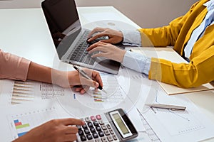 accountant  pointing on laptop for meeting team in office room. concept finance and accounting