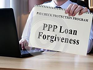 Accountant shows form for PPP loan forgiveness.