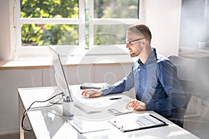 Accountant Using E Invoice Software At Computer