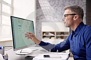 Accountant Using E Invoice Software At Computer