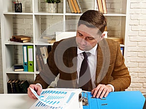 The accountant works with the financial documentation of the company.
