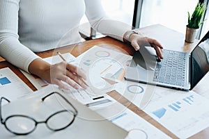 Accountants, Asian auditors are using calculators and computers to review annual tax budgets to submit information to