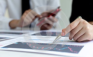 Accountants and financiers are brainstorming the analysis of revenue performance with stock graphs at meetings photo