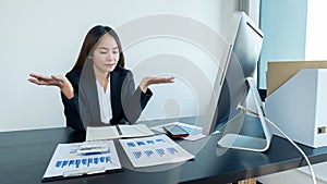Accountants use calculators and computers holding pens and business people analyze financial data and graph reports. financial acc