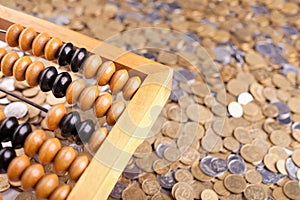 Accounting abacus and coins