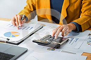 accounting concept. businesswoman working using calculator  in office
