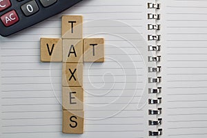 Accounting / Finances background - Taxes and VAT words on scrabb