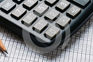 Accounting, financial concept, flat lay, calculator and pensil on wooden table