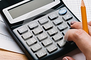 Accounting, financial concept, flat lay, calculator and pensil on wooden table