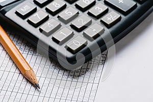 Accounting, financial concept, flat lay, calculator and pensil on wooden table