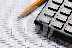 Accounting, financial concept, flat lay, calculator and pensil on wooden table