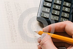 Accounting, financial concept, flat lay, calculator and pensil on wooden table