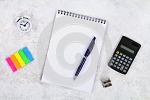 Accounting, financial concept, flat lay or top view of black pen, calculator with white notepad on table with blank copy space, ma