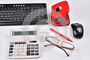 Accounting: invoice, keyboard, calculator, mouse, hole punch, glasses and red pen