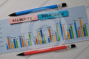 Accounts Receivable write on sticky notes with graphic on the paper isolated on office desk