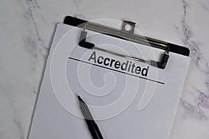 Accredited write on a paperwork isolated on office desk
