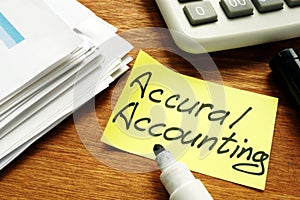 Accrual Accounting concept. Business report and pen.