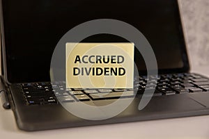 accrued DIVIDEND, text on a notepad on table, business concept