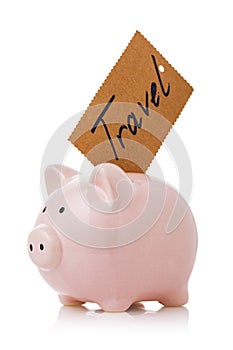 Accumulate travel money. Piggy bank with sticker isolated