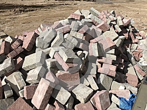 Accumulation of Interlocking stones instead of stacking in a disciplined manner which leads to increasing the wastage of materials