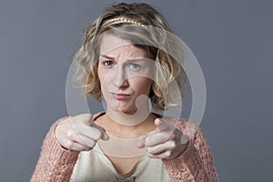 Accusation and worry concept for upset 20s woman photo