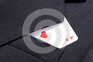 Ace of hearts playing card in business man suit pocket