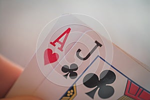 Ace and jack, Playing cards in hand on the table, poker nands