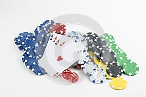 Ace playing cards with red dice. Poker chips on the white background