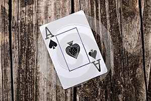Ace of Spades Card on Wood