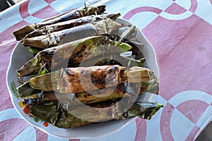 Aceh traditional food called "pulut panggang" made from baked rice and covered with banana's leaf